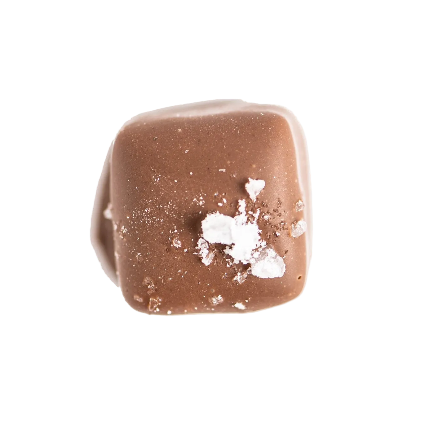A single square piece of milk chocolate topped with a small sprinkle of flaky sea salt, isolated on a white background.