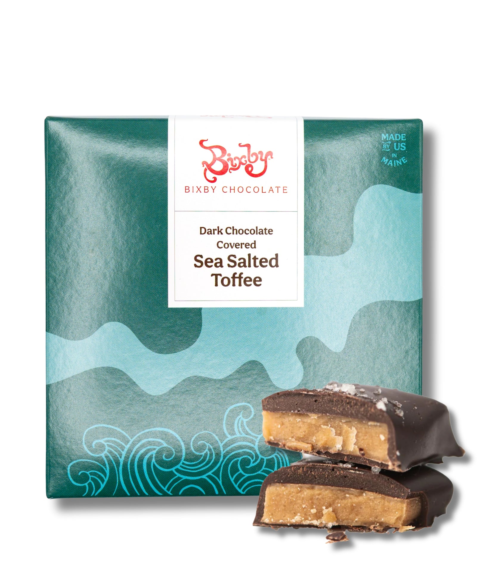 A package of Bixby Chocolates Dark Chocolate Toffee with a teal wave design sits beside two chocolate-covered toffee pieces, one broken to reveal its buttery center.