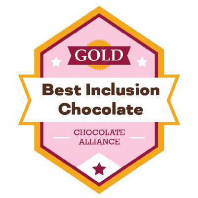 A pink and gold badge reads GOLD Best Inclusion Chocolate with CHOCOLATE ALLIANCE below, featuring stars and a ribbon design.