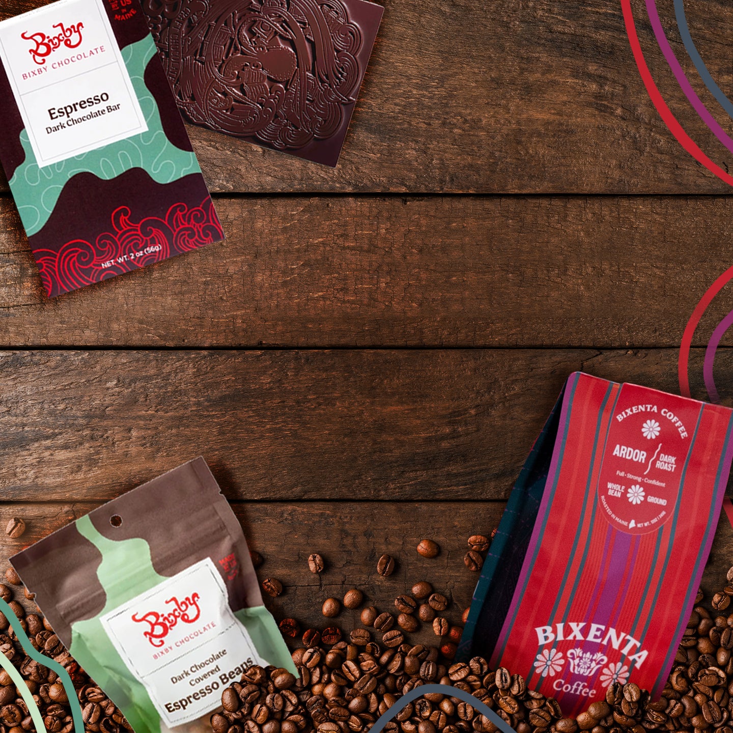 Two chocolate bars, a bag of chocolate espresso beans, and scattered coffee beans are arranged on a wooden surface. The packaging features colorful designs and branding from Bixenta, a coffee and chocolate brand.
