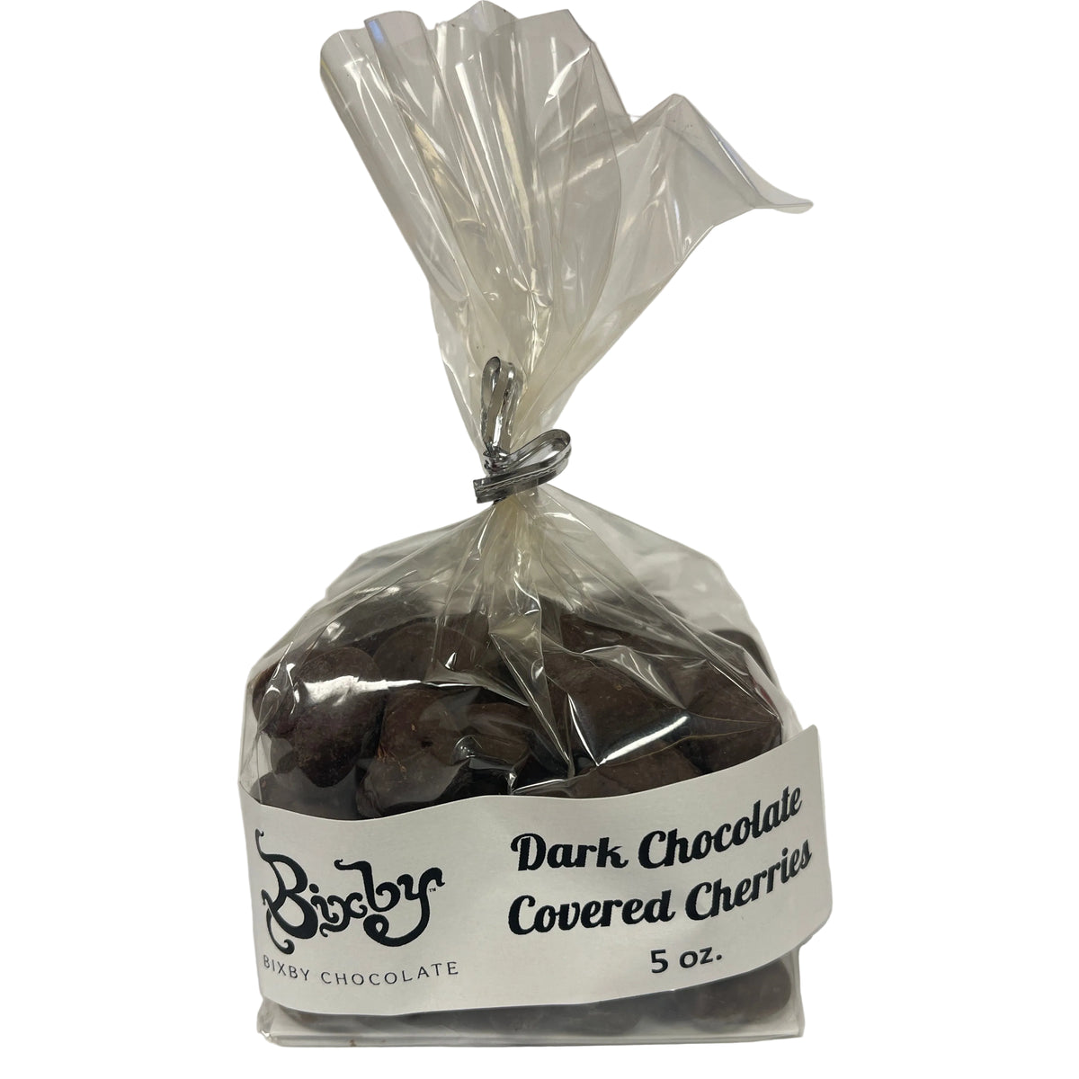 Bag of dark chocolate-covered cherries with a visible label on a white background