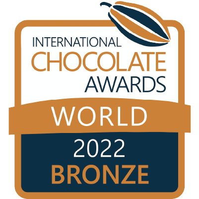 International Chocolate Awards 2022 World Bronze Winner badge, featuring a stylized cocoa pod and bold gold, white, and dark blue text.