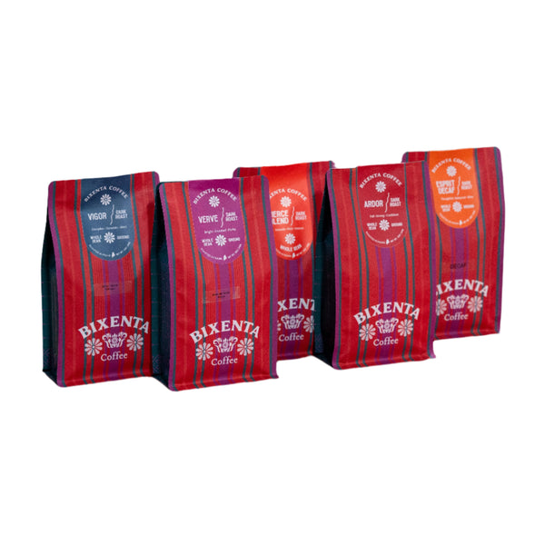 Four red-striped Bixenta Coffee bags from Bixby Chocolates are lined up, each small-batch roasted and featuring a unique name and color: Vigor (blue), Verve (purple), Origin Blend (red), and Ardor (orange).